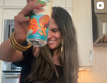 Creator holding product